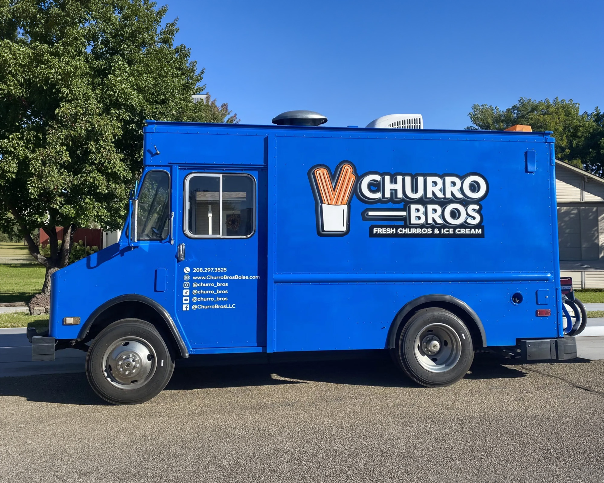 The blue Churro Bros food truck — fresh churros & ice cream